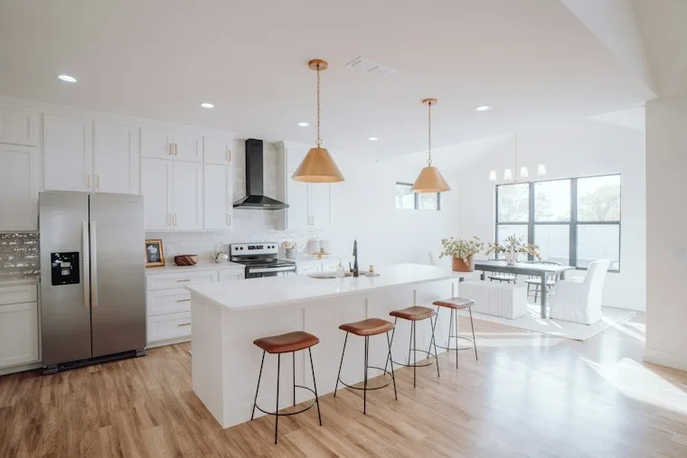 Bright kitchen with a center island and bar stools