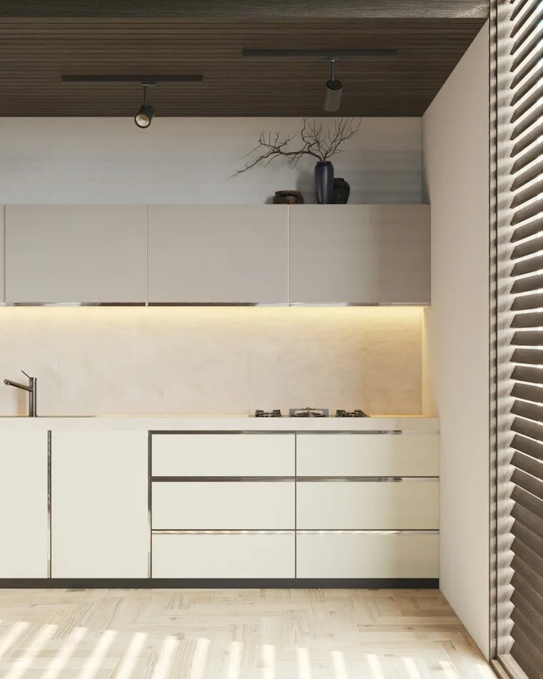 Bright kitchen with white cabinets and a warm wooden ceiling
