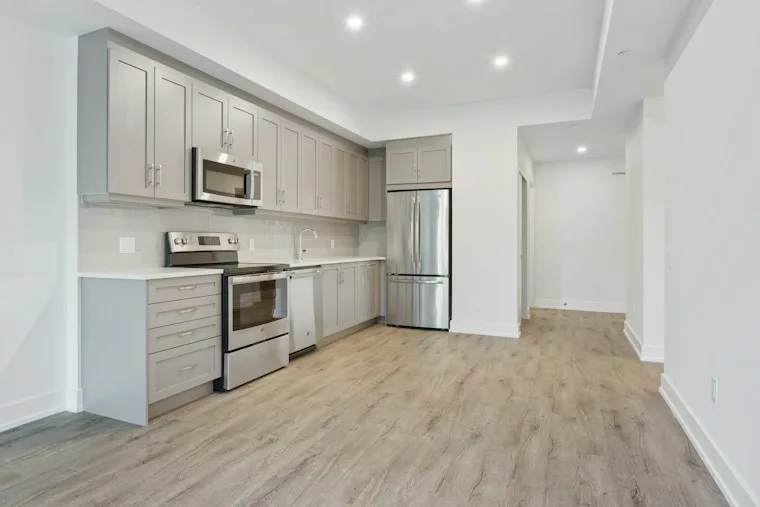Elegant kitchen with white and warm wood cabinets