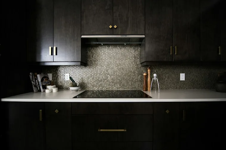 Empty stainless steel kitchen sink with a faucet