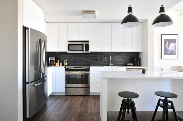Gray stainless three-door refrigerator in a modern kitchen
