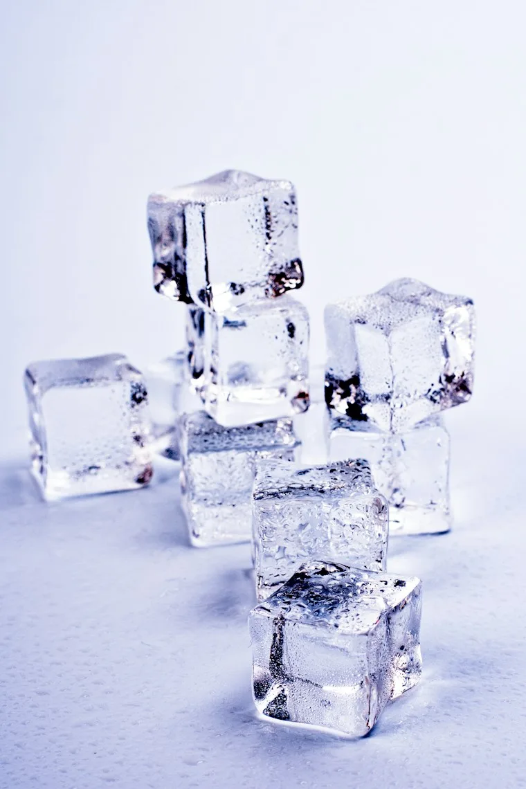 Group of clear ice cubes sitting on a table