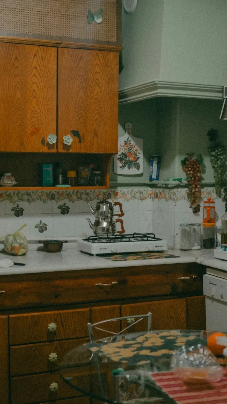 Home kitchen with a stove top and oven next to a counter