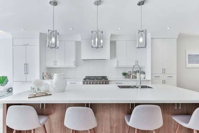 Kitchen with white and warm wood cabinets
