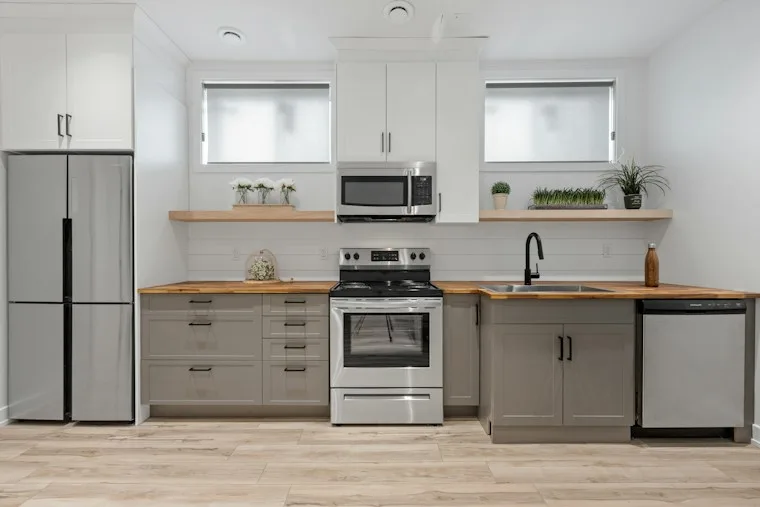 Kitchen with white cabinets and a clean, open layout in a newer home
