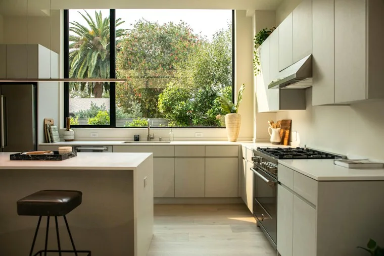 Modern kitchen with a large island and a big window