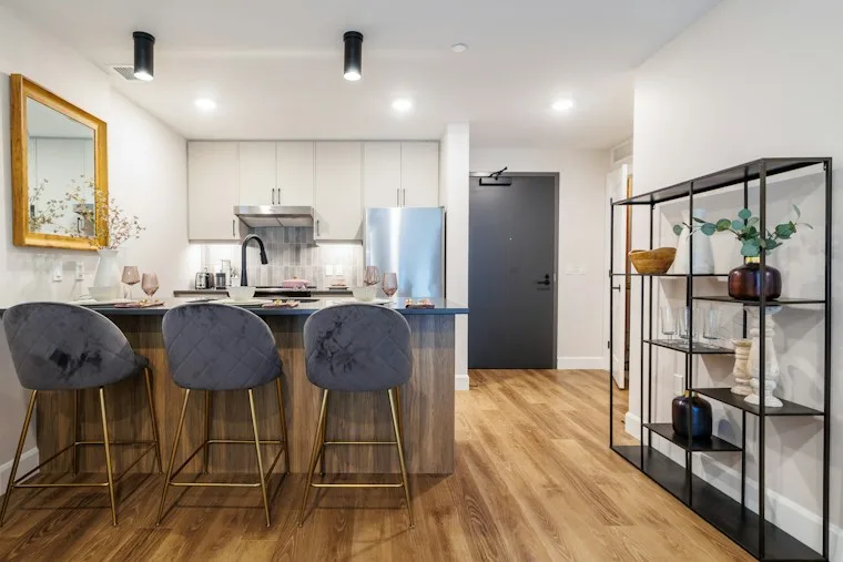Modern kitchen with an island, bar stools and built-in cooking area