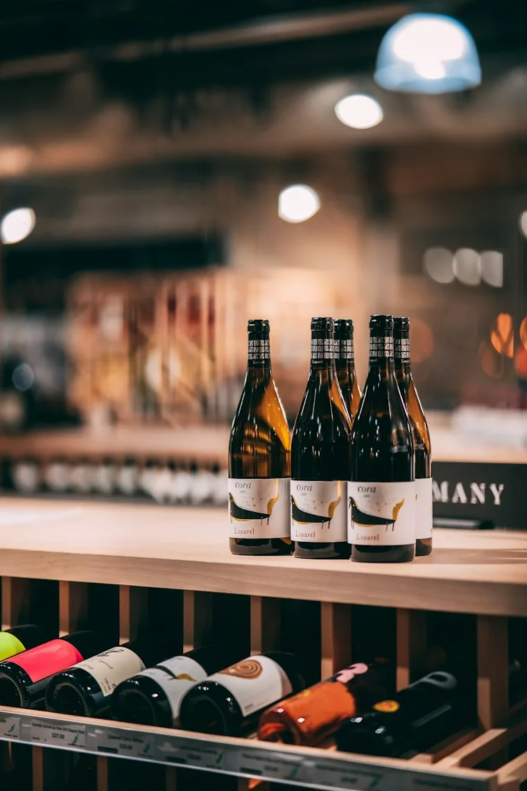 Shelf lined with bottles of wine stored on their sides