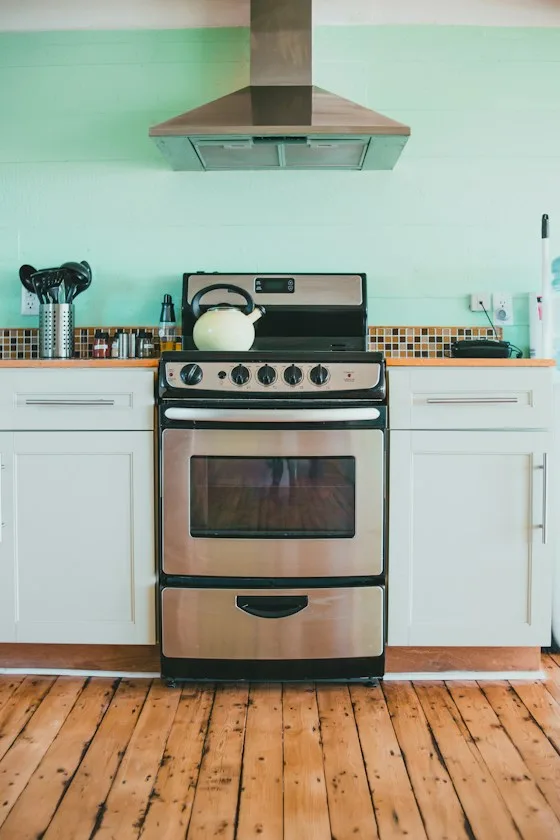 White and black gas range oven in a home kitchen