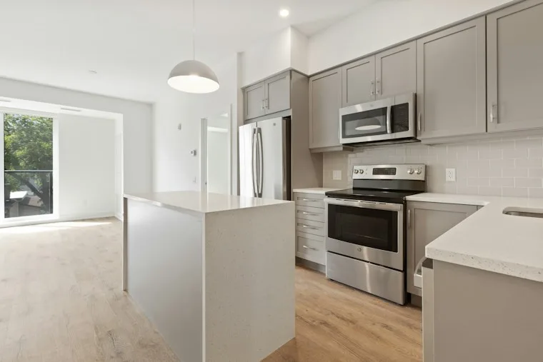 White and black kitchen cabinets in a bright home kitchen
