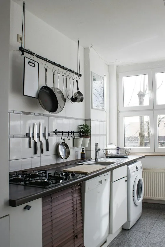 White built-in dishwasher under a kitchen counter