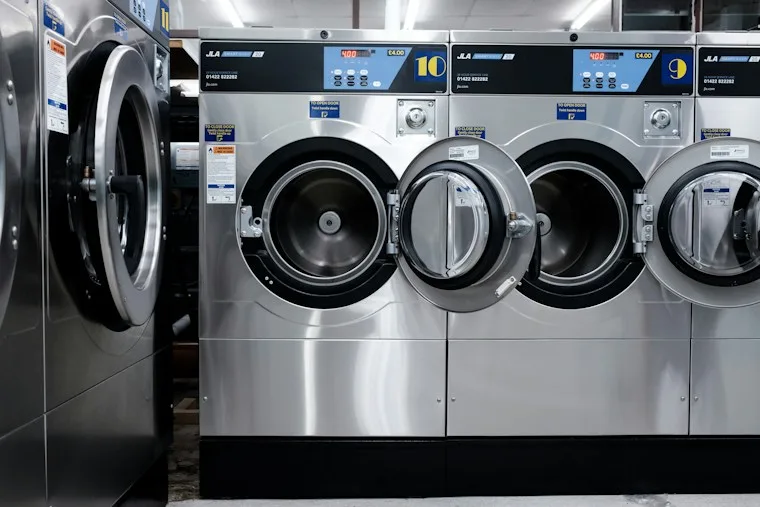 White front-load washing machine in a laundry room