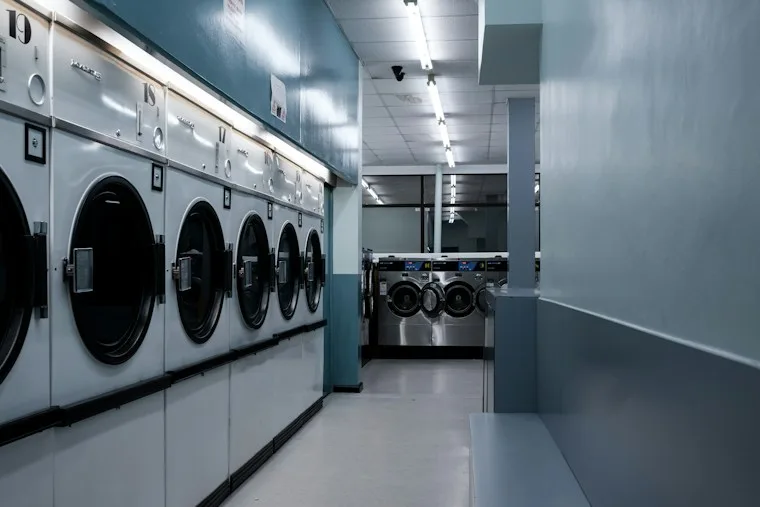 White front-load washing machines lined up together