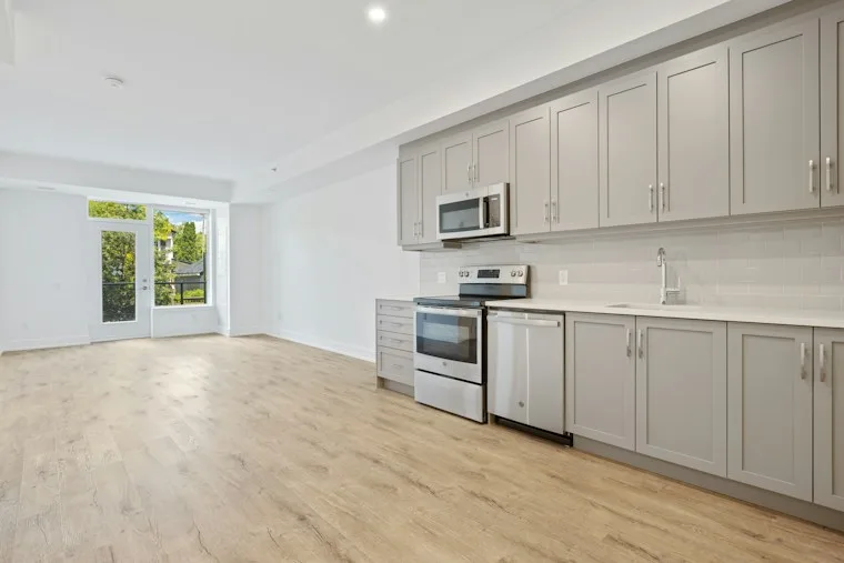 White wooden kitchen cabinet against a white wall